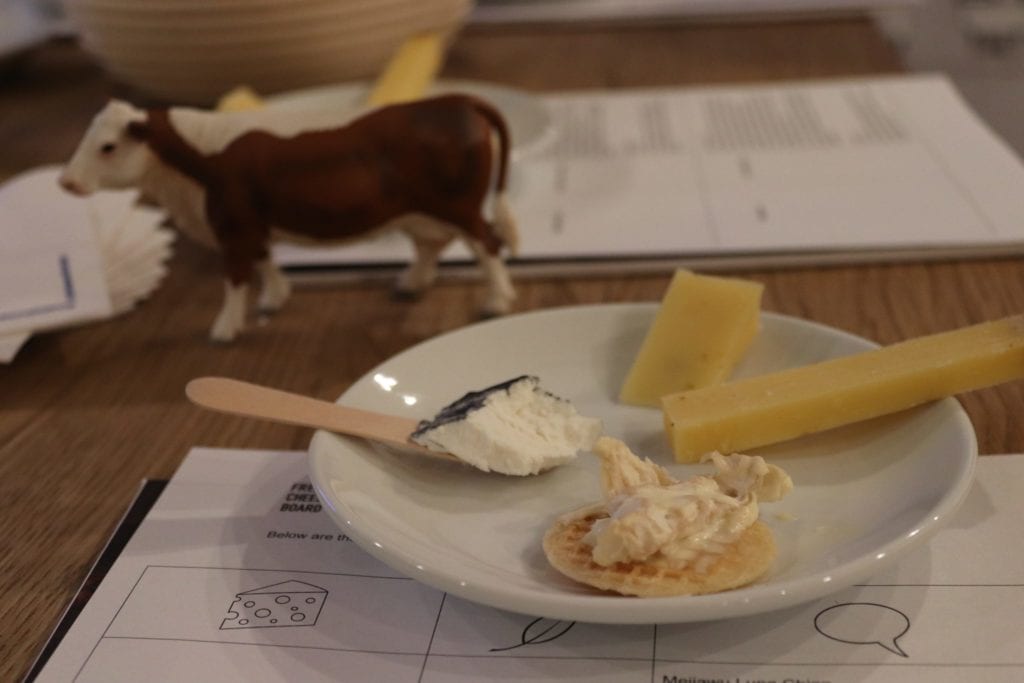 Cheese on a plate with a cow figurine