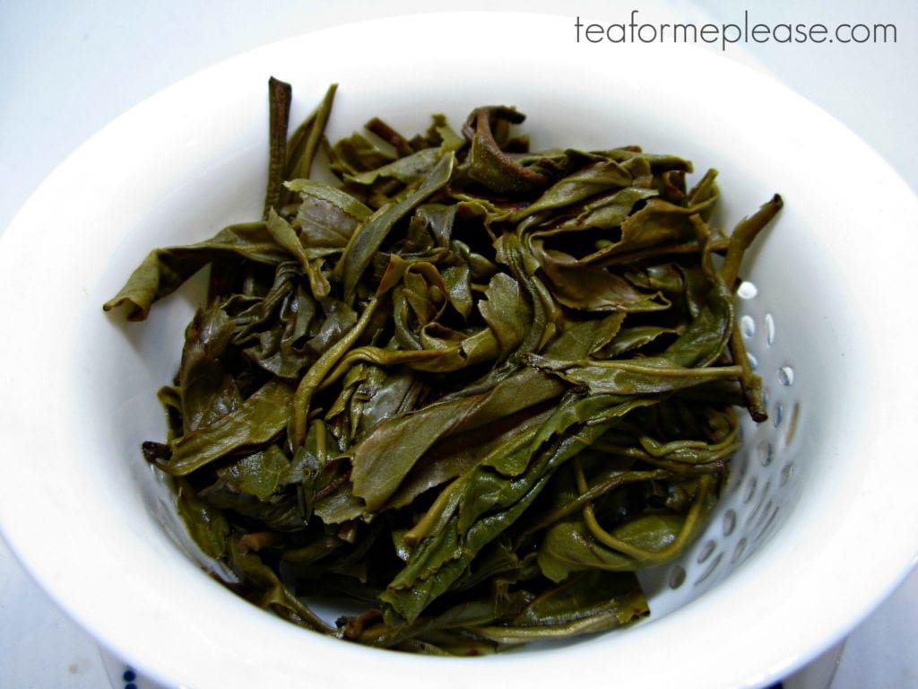 puerh leaves in white gaiwan