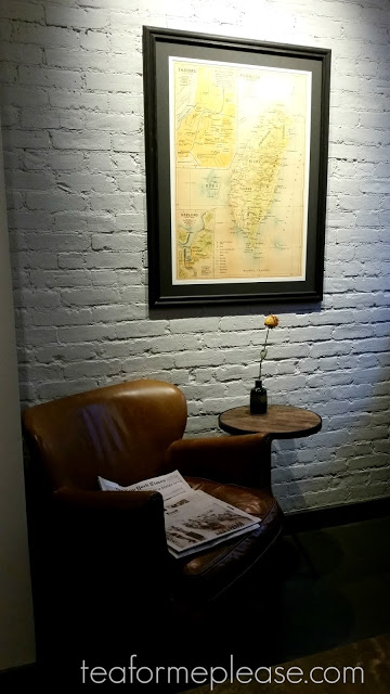 Leather chair with map of Taiwan on a white wall