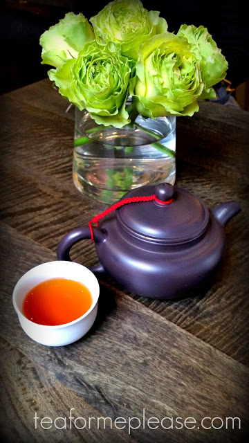 Clay teapot with green flowers