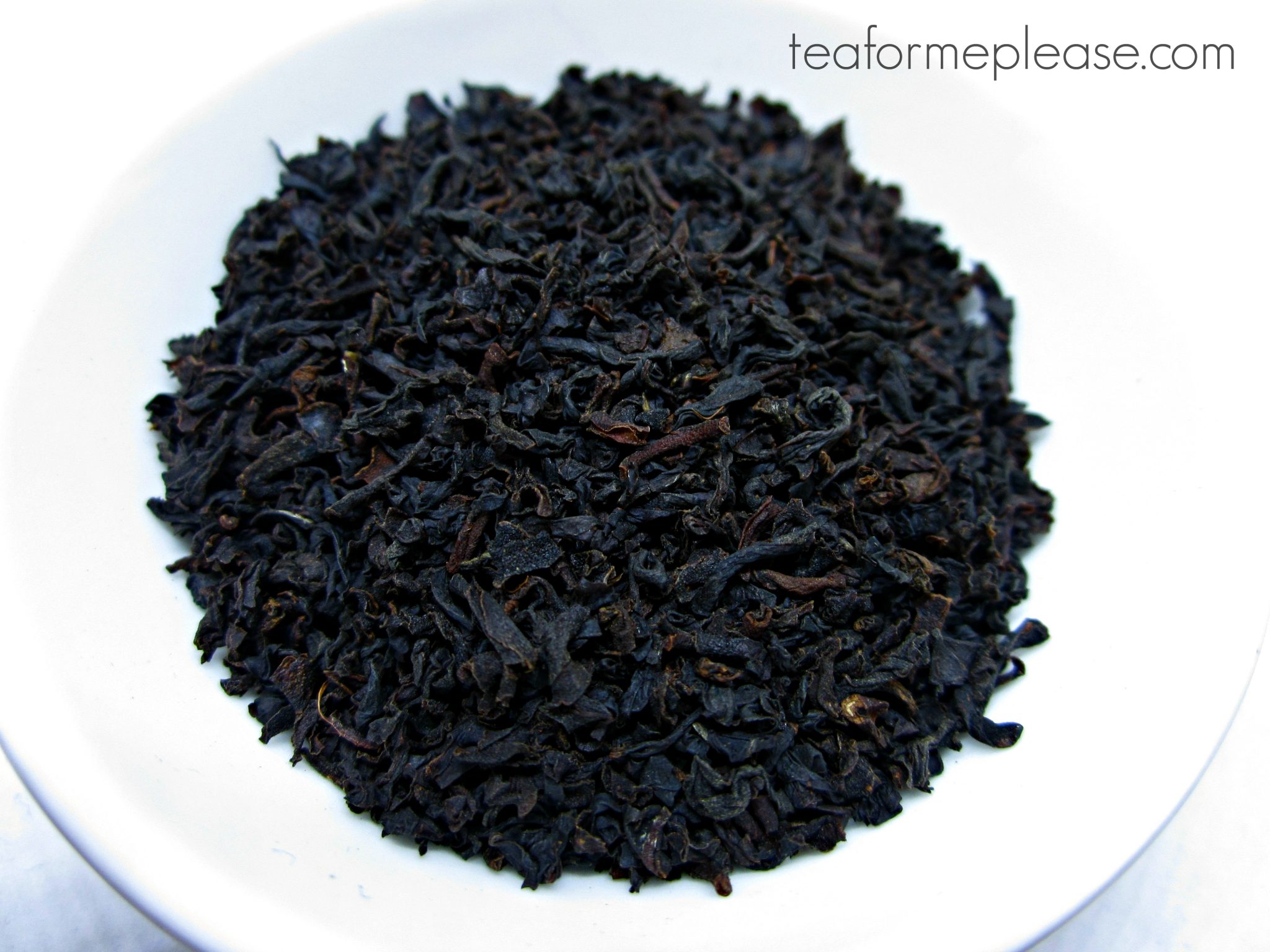Ceylon black tea leaves on a white dish