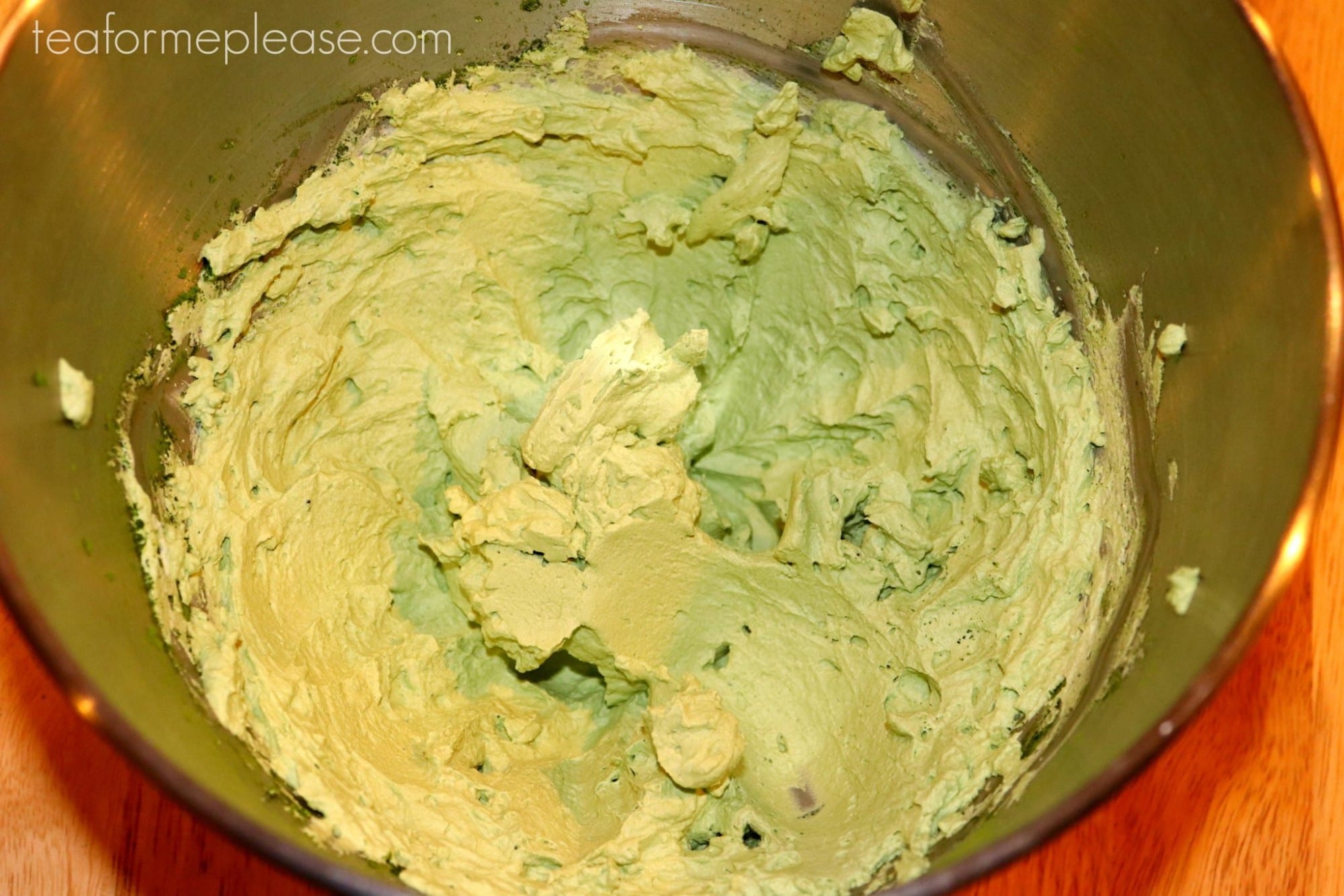 Matcha whipped cream in stainless steel bowl