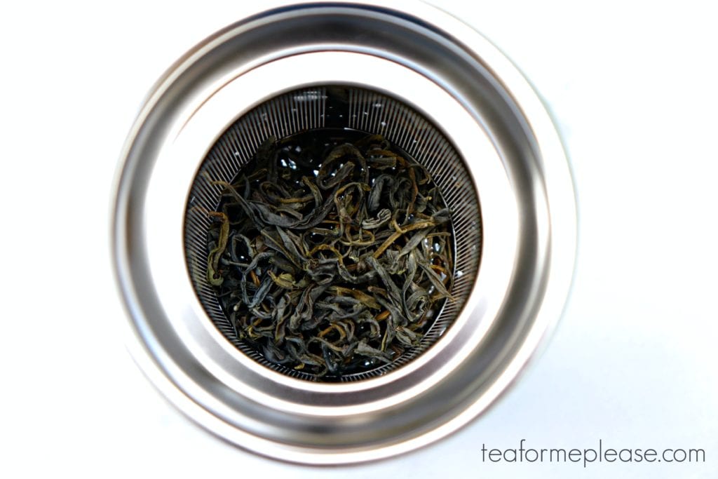 Get Started Drinking Tea - Stainless steel infuser basket filled with green tea leaves