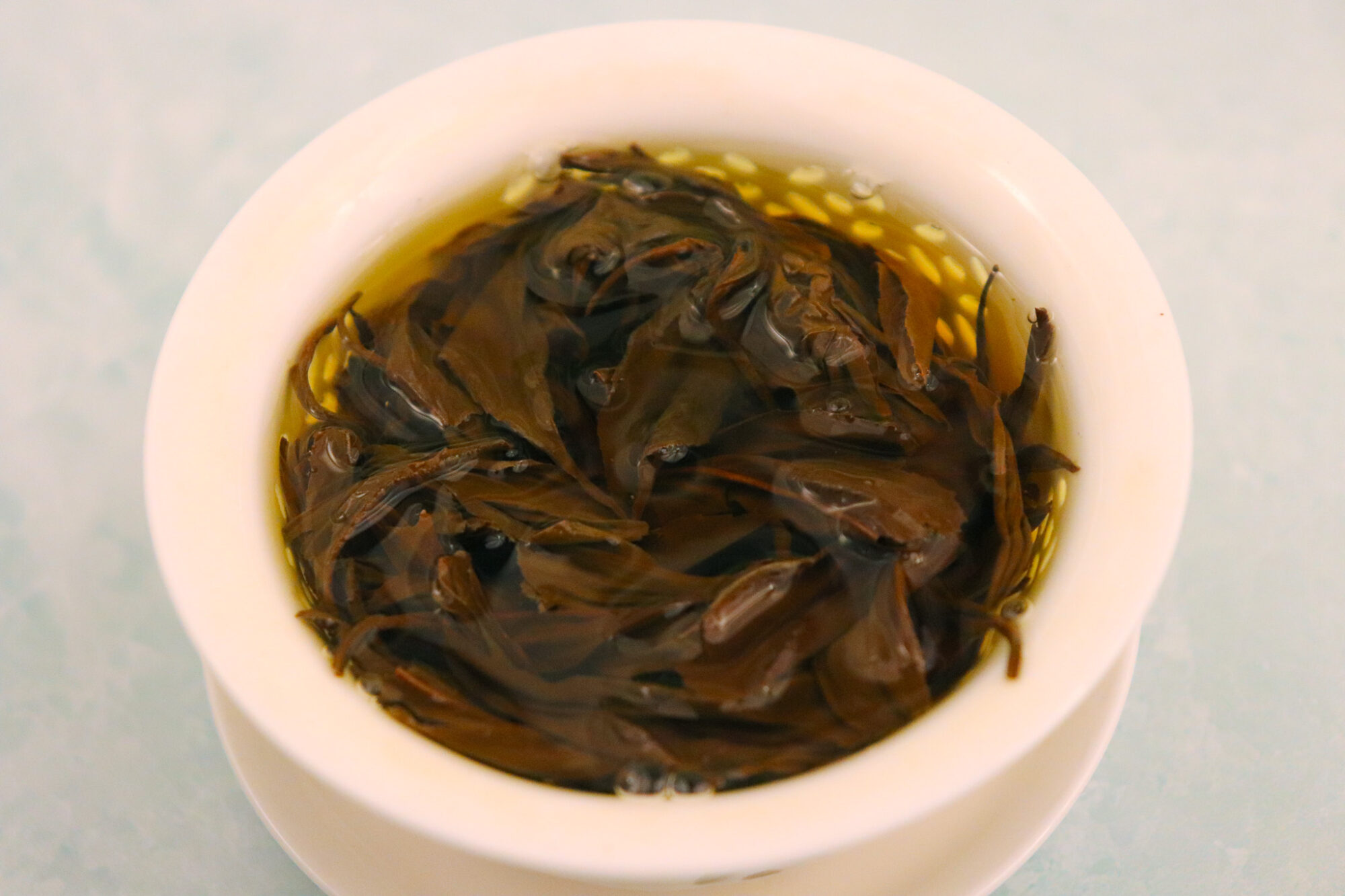 Grand Crew Purple Bud - leaves brewing in a gaiwan