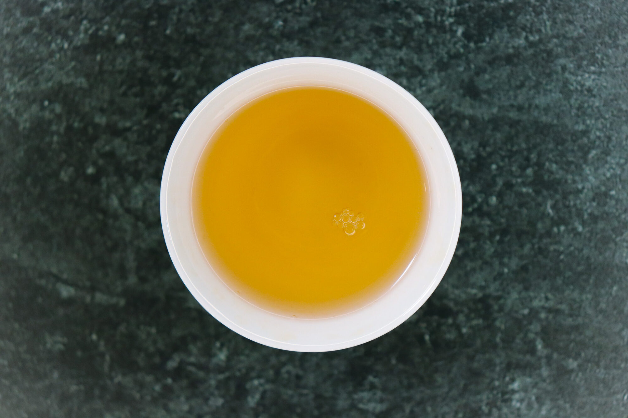Gopaldhara Tea Nectar of Darjeeling - brewed tea in a white teacup