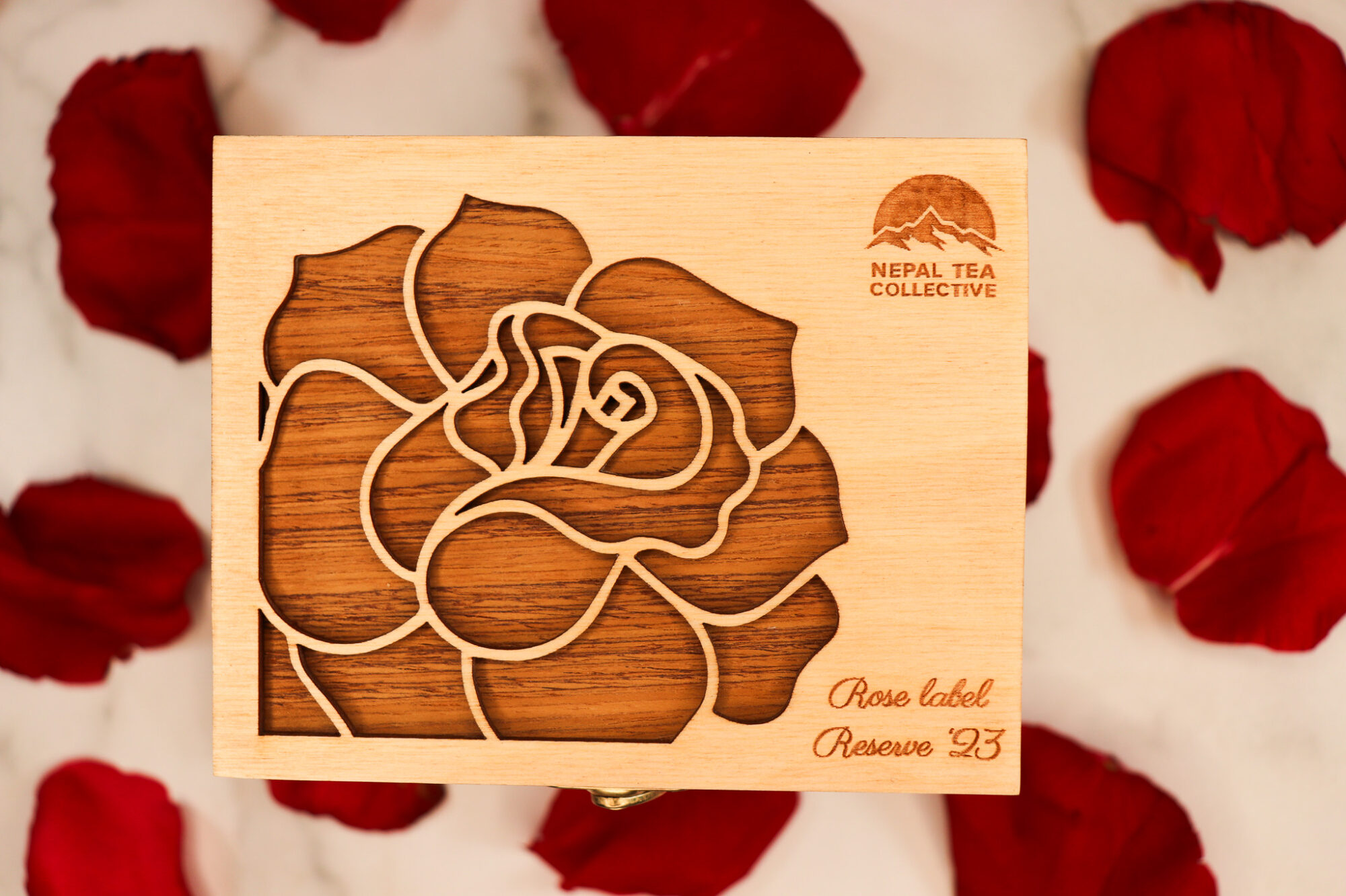 Rose Label Reserve - wooden box with a background of rose petals