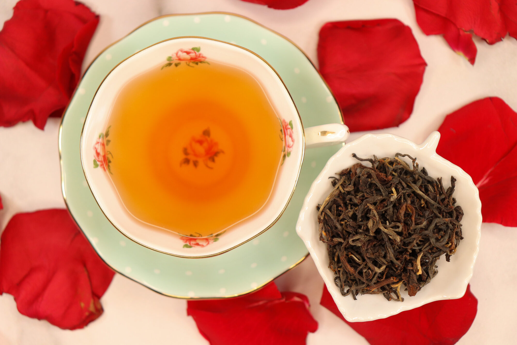 Rose Label Reserve - cup of brewed tea alongside a small dish showing rhe tea leaves