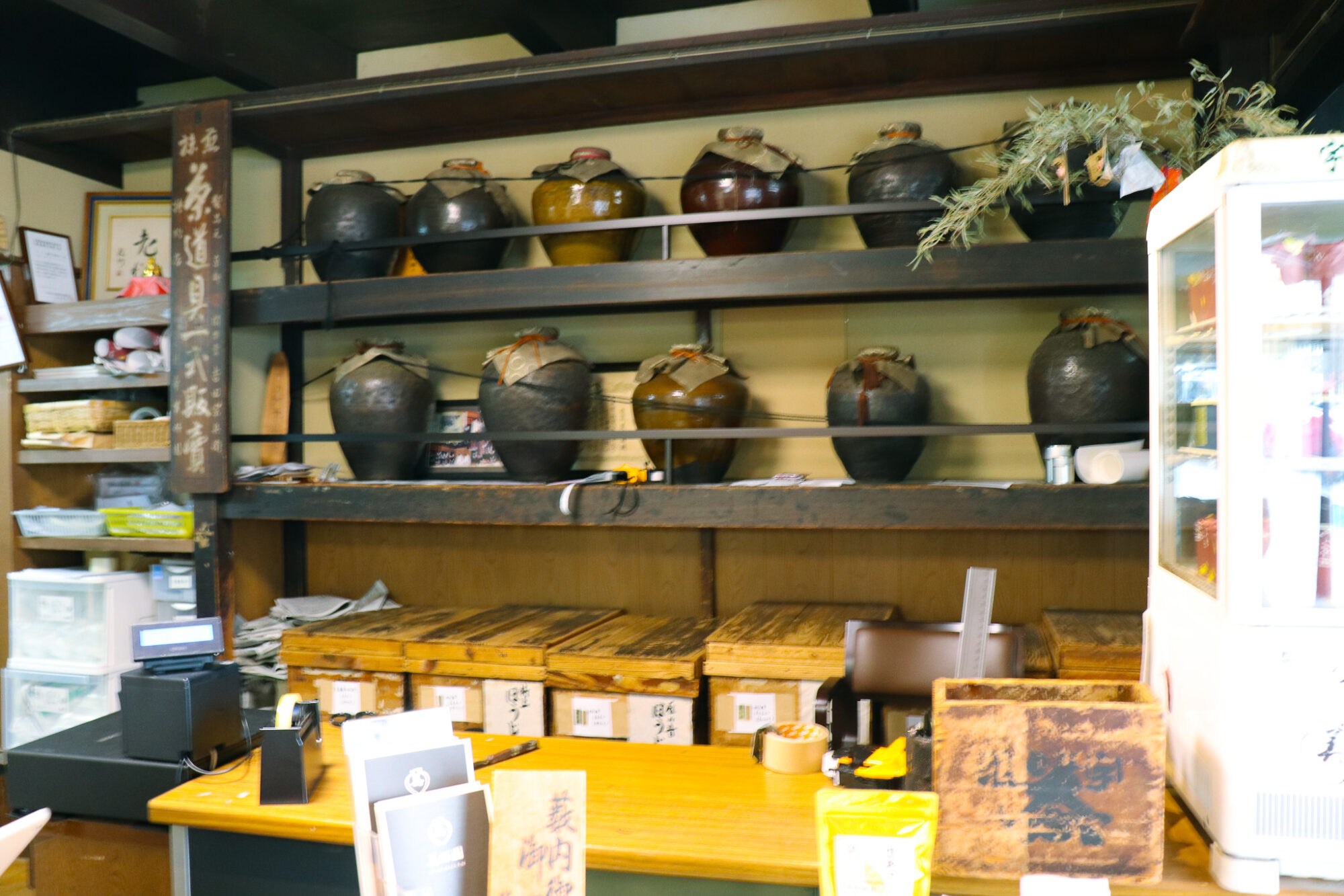 Shelves of ceramic tea jars - Tea Places: Bikouen