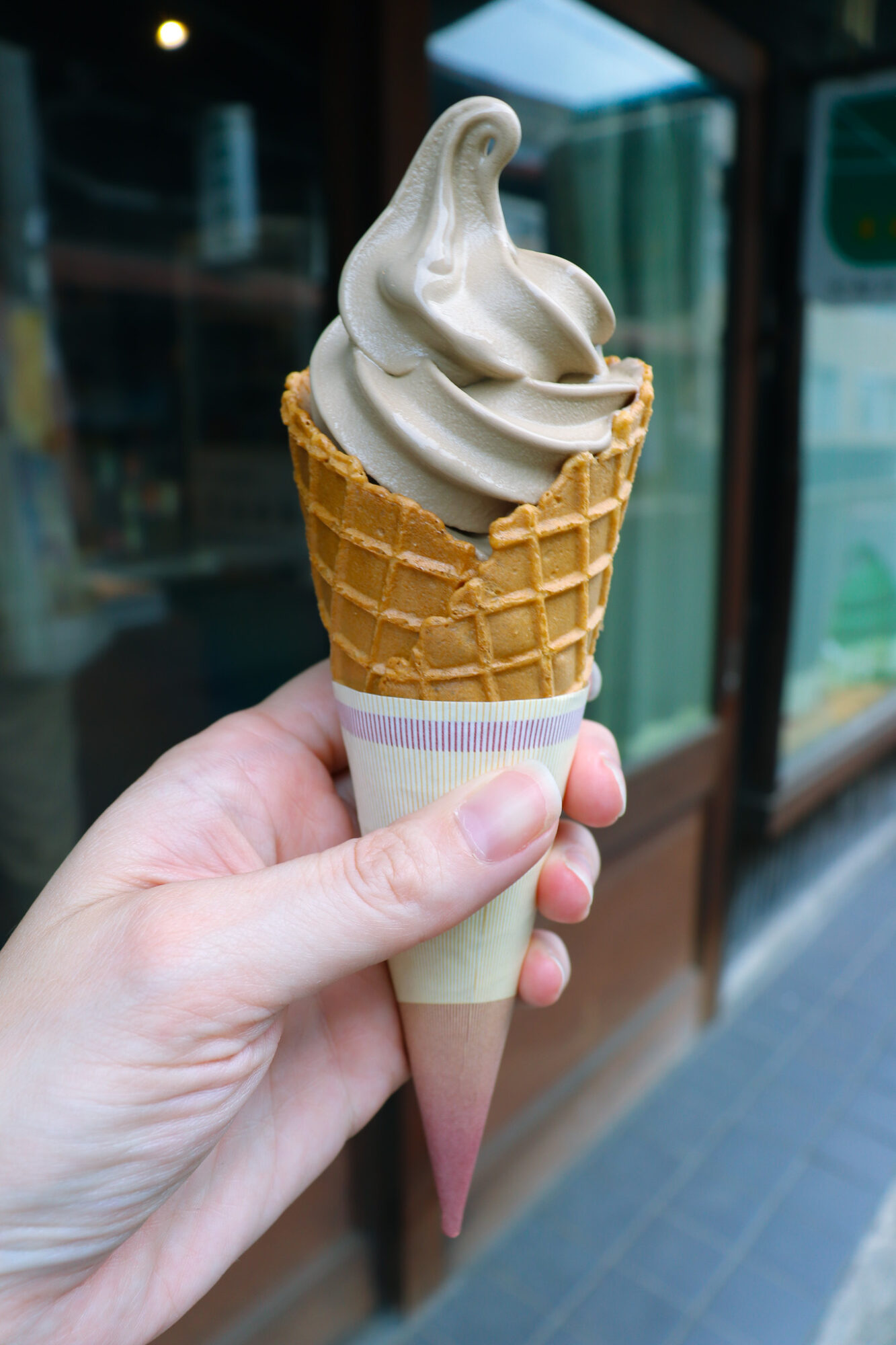 A cone of hojicha soft serve ice cream - Tea Places: Bikouen